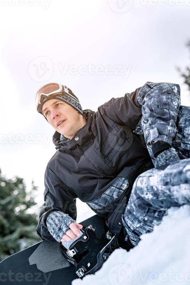 Snowboarder on snow photo