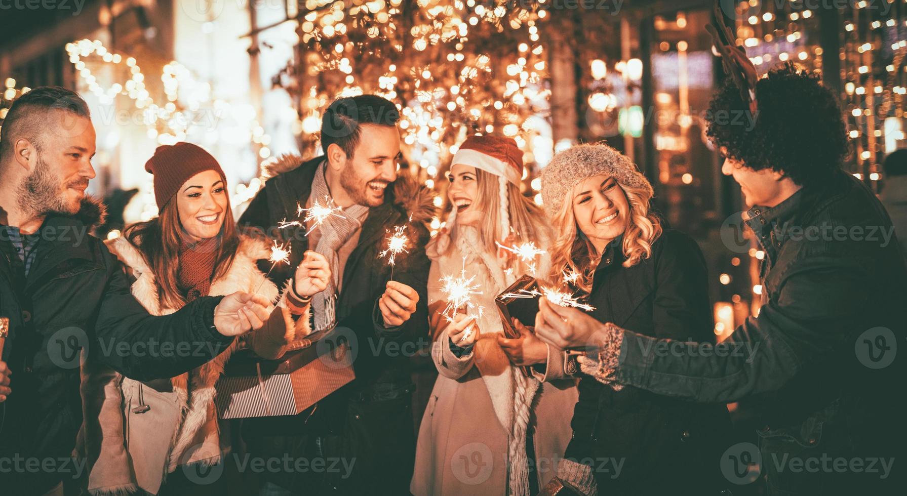 Friends With Sparklers At The New Year Party photo