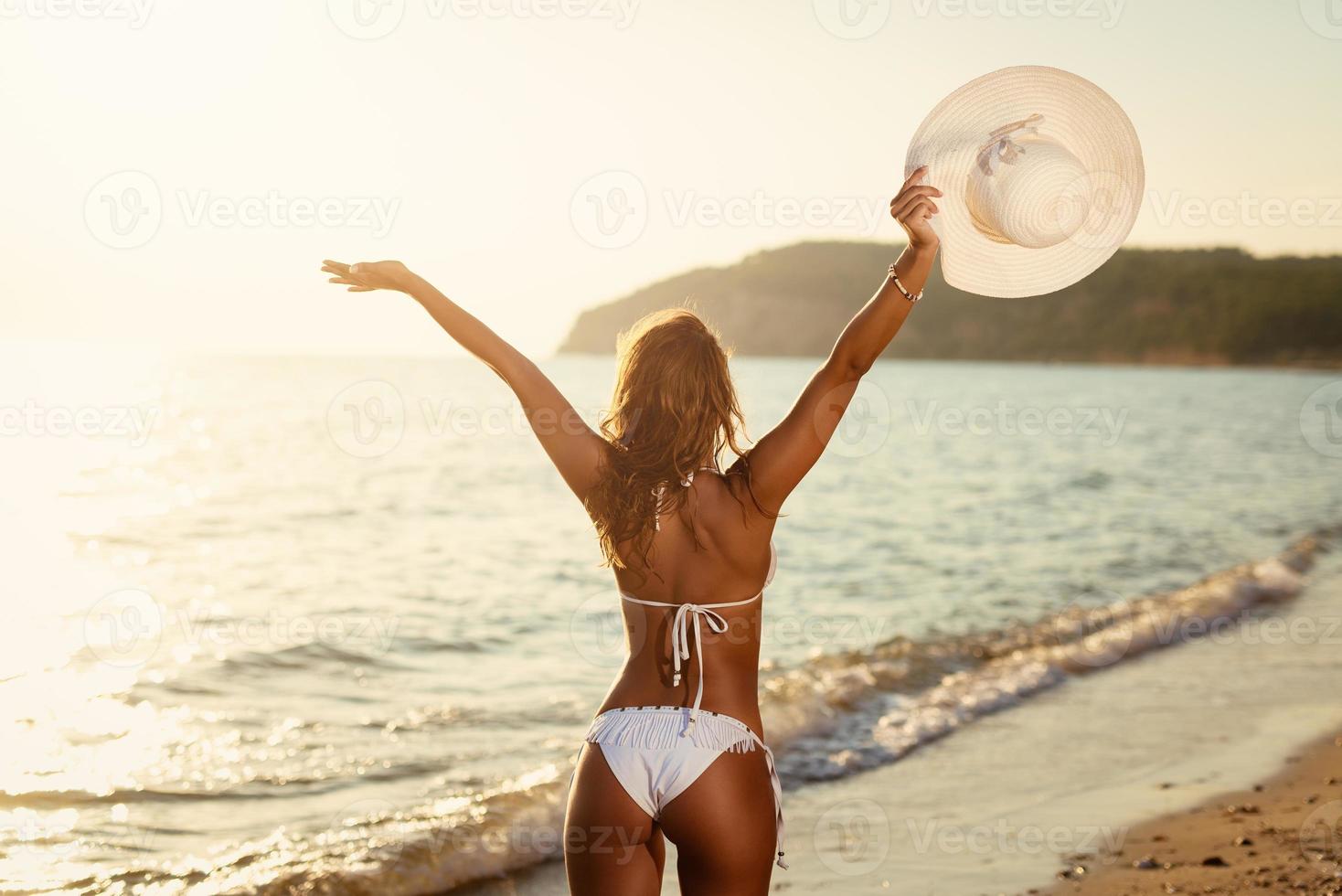 Girl Relaxing On The Beach photo