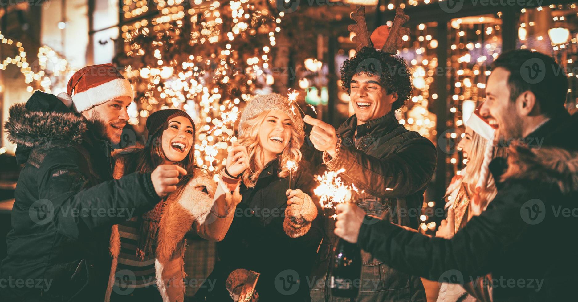 Friends With Sparklers At The New Year Party photo