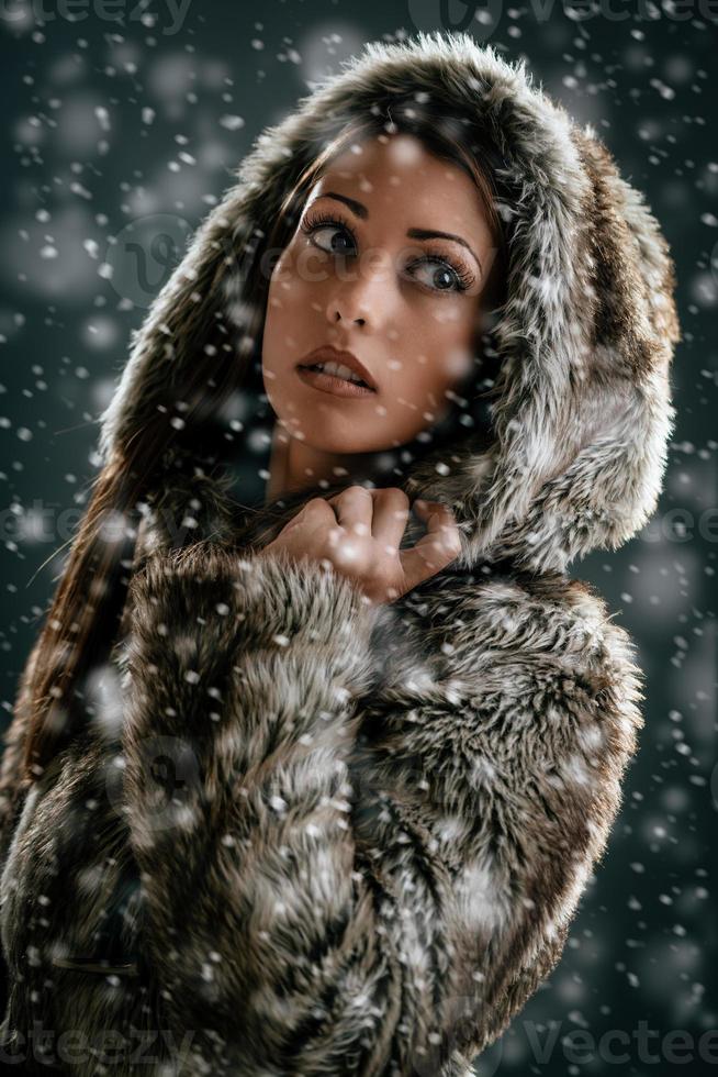 Girl Is Looking Through Snowflakes photo