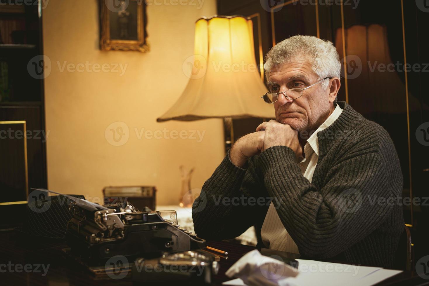 Pensive Retro Senior Man Writer photo