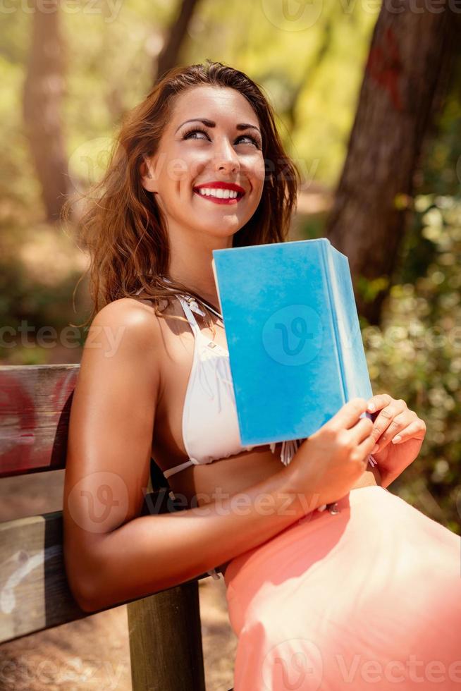 Pensive Girl In Sunny Forest photo