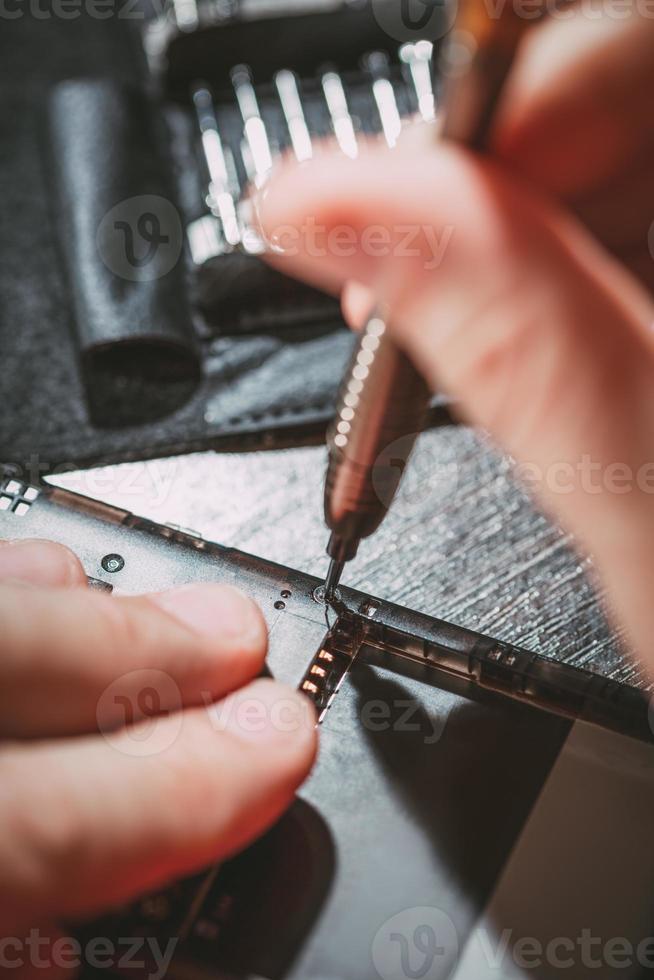 Man Repairing A Mobile phone photo