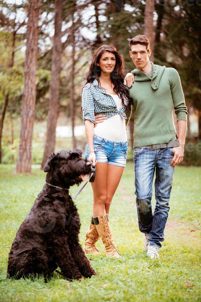 Smiling Couple With A Dog photo