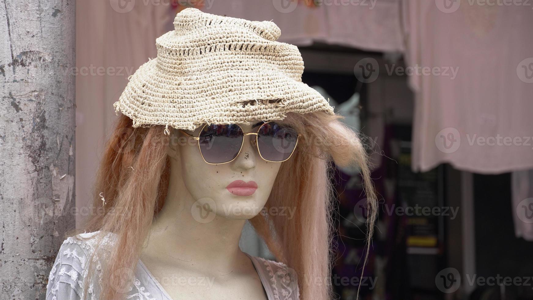 white mannequin wearing hat and goggles. photo