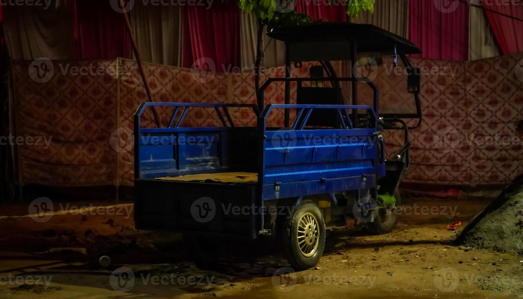 Battery rickshaw of blue colour photo