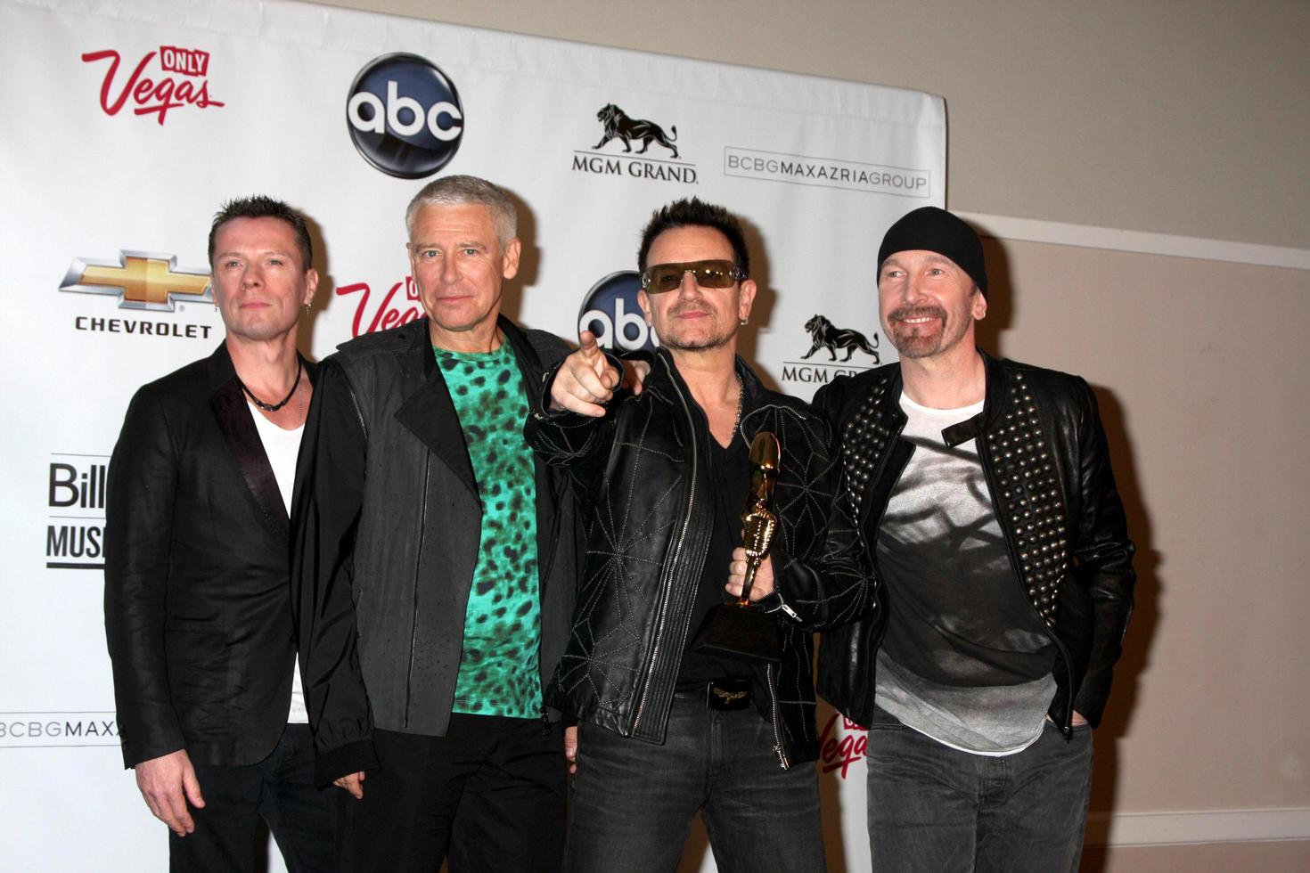 LAS VEGAS, MAY 22 - U2 Larry Mullen Jr, Adam Clayton, Bono and The Edge in the Press Room of the 2011 Billboard Music Awards at MGM Grand Garden Arena on May 22, 2010 in Las Vegas, NV photo