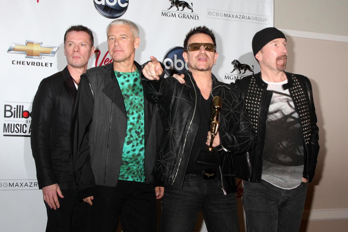 LAS VEGAS, MAY 22 - U2 Larry Mullen Jr, Adam Clayton, Bono and The Edge in the Press Room of the 2011 Billboard Music Awards at MGM Grand Garden Arena on May 22, 2010 in Las Vegas, NV photo