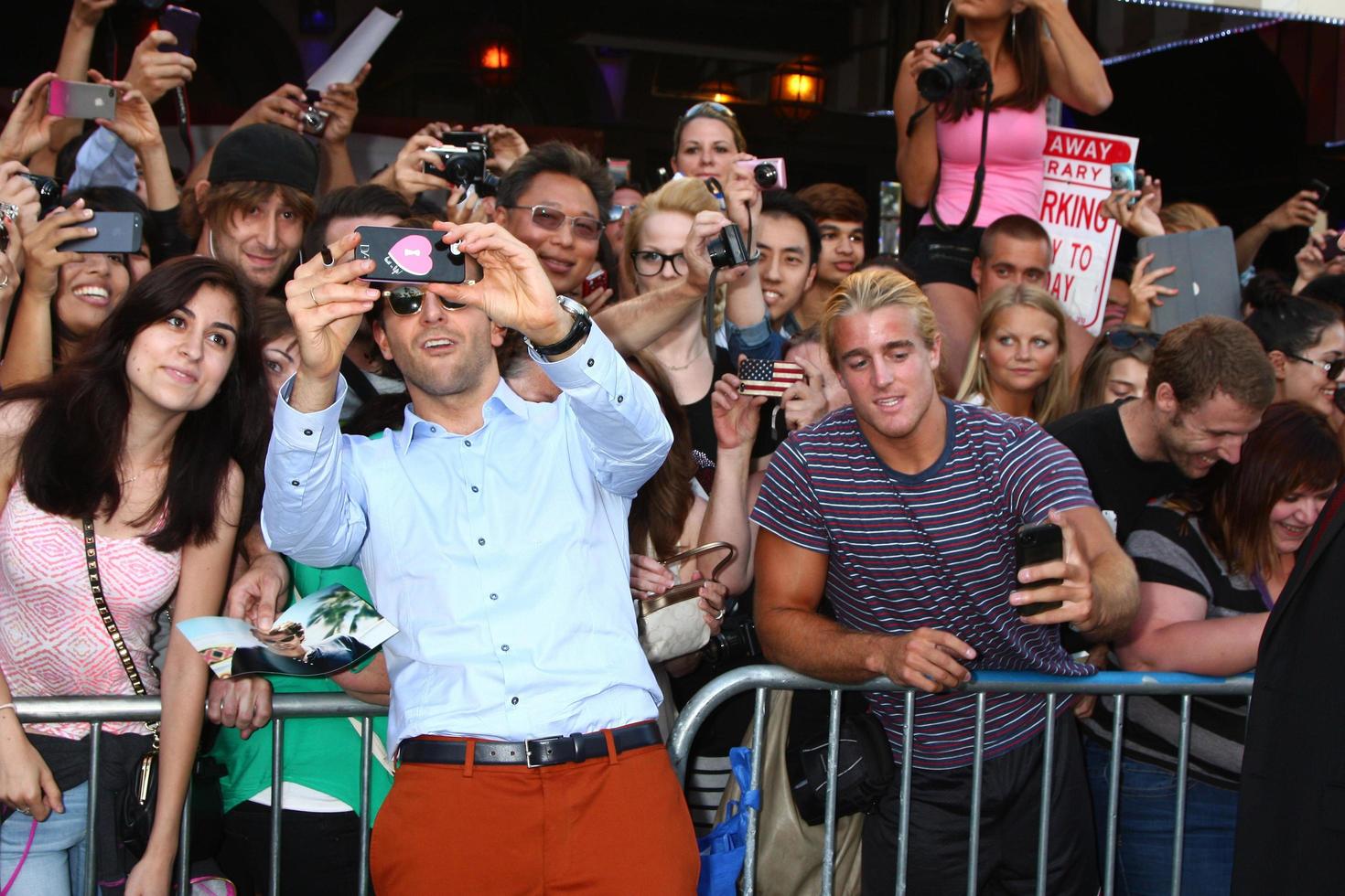 LOS ANGELES, MAY 16 - Bradley Cooper interacts with fans at the Hangover III LA premiere at the Village Theater on May 16, 2013 in Westwood, CA photo