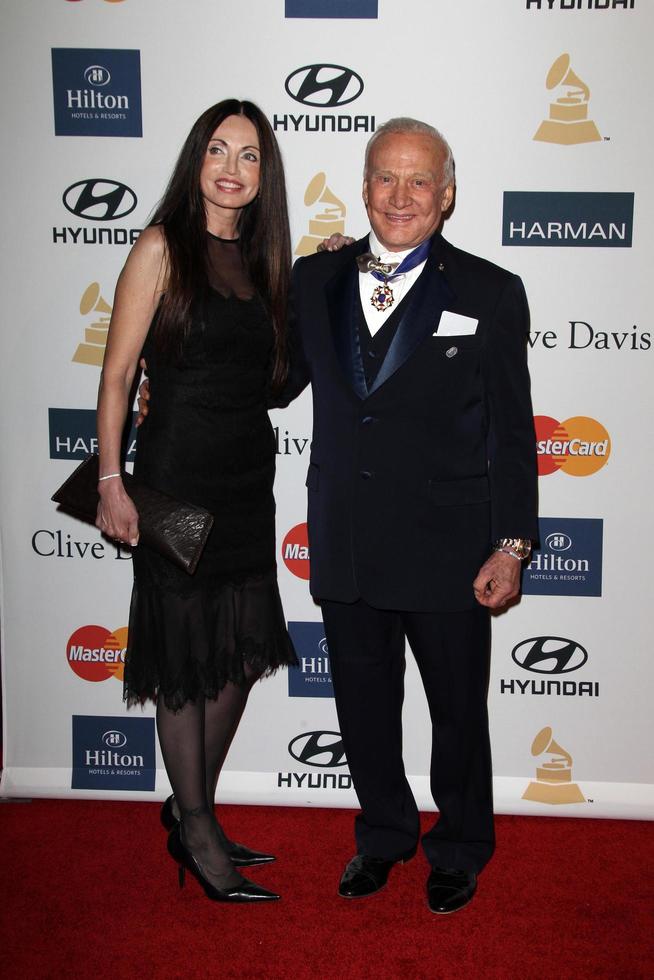 LOS ANGELES, FEB 9 - Carolyn Hollingsworth, Buzz Aldrin arrives at the Clive Davis 2013 Pre-GRAMMY Gala at the Beverly Hilton Hotel on February 9, 2013 in Beverly Hills, CA photo
