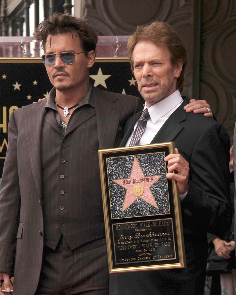 LOS ANGELES, JUN 24 - Johnny Depp, Jerry Bruckheimer at the Jerry Bruckheimer Star on the Hollywood Walk of Fame at the El Capitan Theater on June 24, 2013 in Los Angeles, CA photo