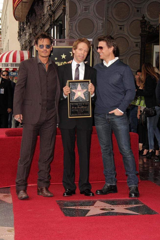 LOS ANGELES, JUN 24 - Johnny Depp, Jerry Bruckheimer, Tom Cruise at the Jerry Bruckheimer Star on the Hollywood Walk of Fame at the El Capitan Theater on June 24, 2013 in Los Angeles, CA photo