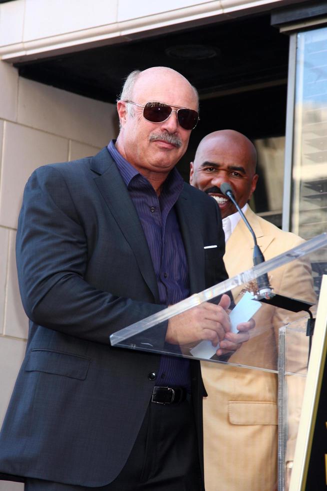 LOS ANGELES, MAY 13 - Dr Phil McGraw, Steve Harvey at the Steve Harvey Hollywood Walk of Fame Star Ceremony at the W Hollywood Hotel on May 13, 2013 in Los Angeles, CA photo