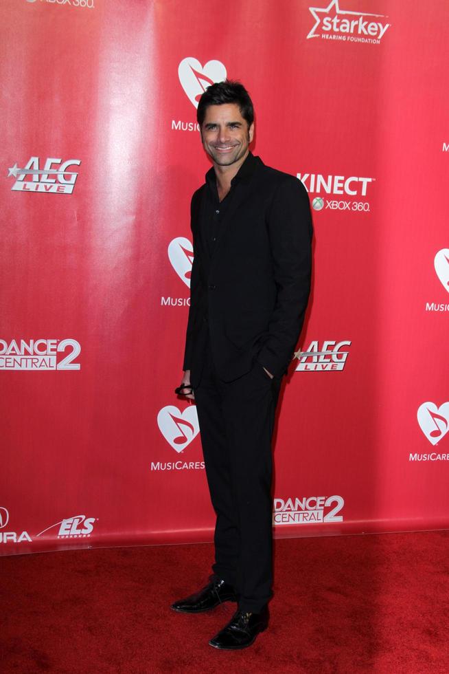LOS ANGELES, FEB 10 - John Stamos arrives at the 2012 MusiCares Gala honoring Paul McCartney at LA Convention Center on February 10, 2012 in Los Angeles, CA photo
