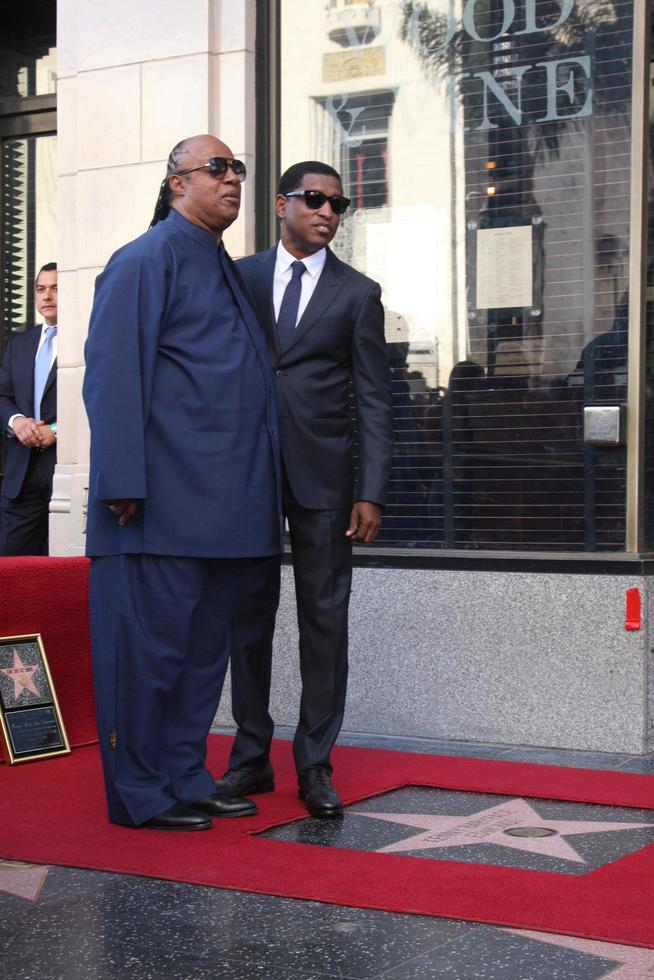 LOS ANGELES, OCT 10 - Stevie Wonder, Kenny Babyface Edmonds at the Kenny Babyface Edmonds Hollywood Walk of Fame Star Ceremony at Hollywood Boulevard on October 10, 2013 in Los Angeles, CA photo