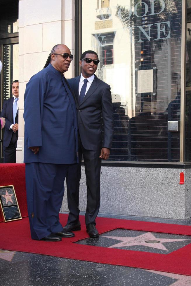 LOS ANGELES, OCT 10 - Stevie Wonder, Kenny Babyface Edmonds at the Kenny Babyface Edmonds Hollywood Walk of Fame Star Ceremony at Hollywood Boulevard on October 10, 2013 in Los Angeles, CA photo