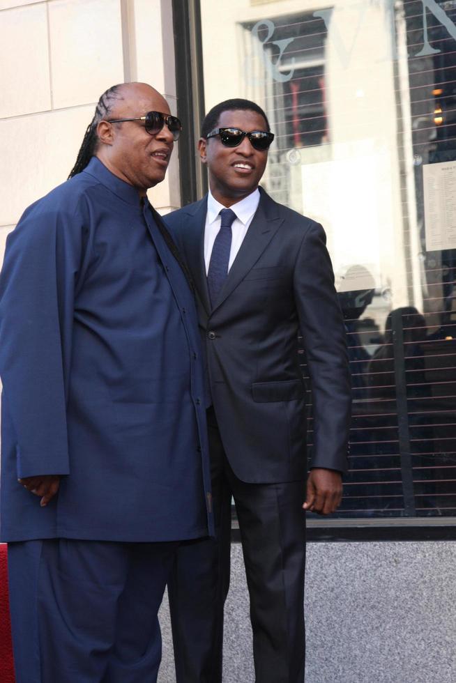 LOS ANGELES, OCT 10 - Stevie Wonder, Kenny Babyface Edmonds at the Kenny Babyface Edmonds Hollywood Walk of Fame Star Ceremony at Hollywood Boulevard on October 10, 2013 in Los Angeles, CA photo