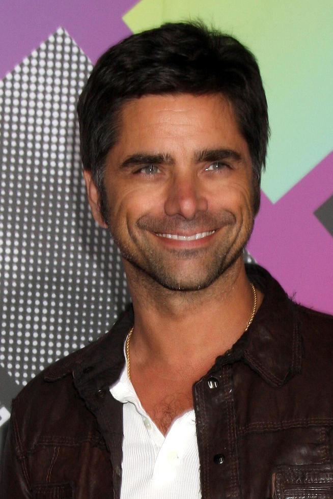 LOS ANGELES, APR 20 - John Stamos arriving at the Launch Of The New T-Mobile Sidekick 4G at Old Robinson May Building on April 20, 2011 in Beverly Hills, CA photo