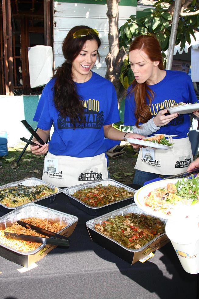 LOS ANGELES, FEB 9 - Theresa Castillo and Emily Wilson getting lunch at the 4th General Hospital Habitat for Humanity Fan Build Day at the 191 E Marker Street on February 9, 2013 in Long Beach, CA photo
