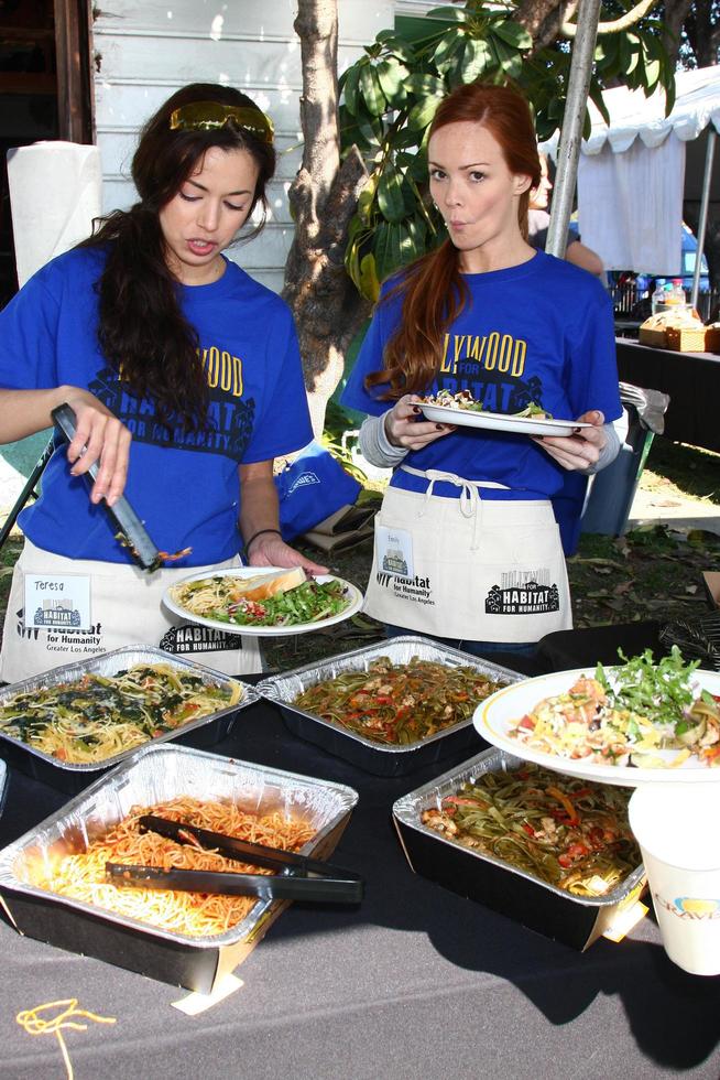 LOS ANGELES, FEB 9 - Theresa Castillo and Emily Wilson getting lunch at the 4th General Hospital Habitat for Humanity Fan Build Day at the 191 E Marker Street on February 9, 2013 in Long Beach, CA photo