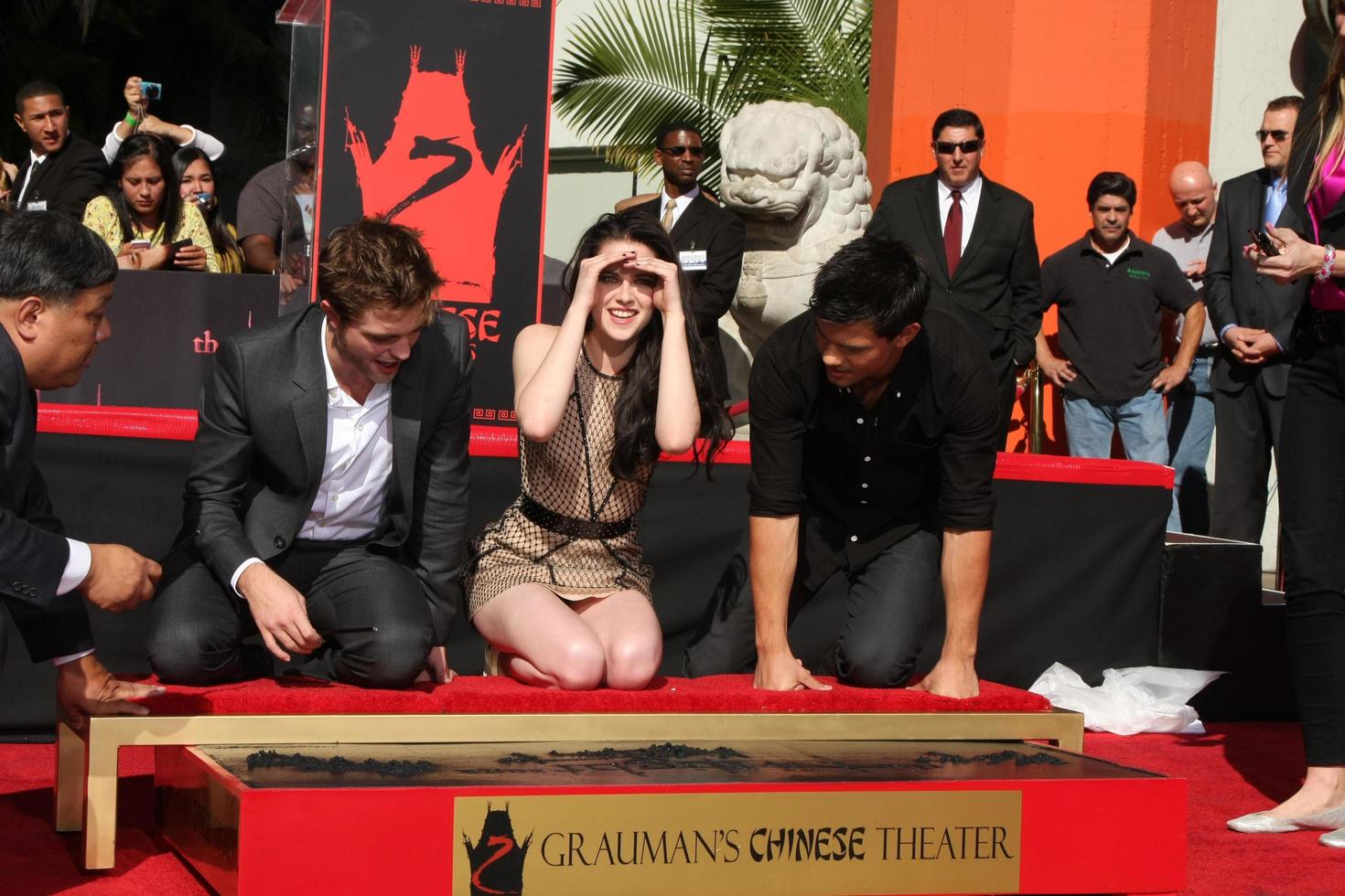 LOS ANGELES, NOV 3 - Robert Pattinson, Kristen Stewart, Taylor Lautner at the Handprint and Footprint Ceremony for the Twilight Saga Actors at Grauman s Chinese Theater on November 3, 2011 in Los Angeles, CA photo