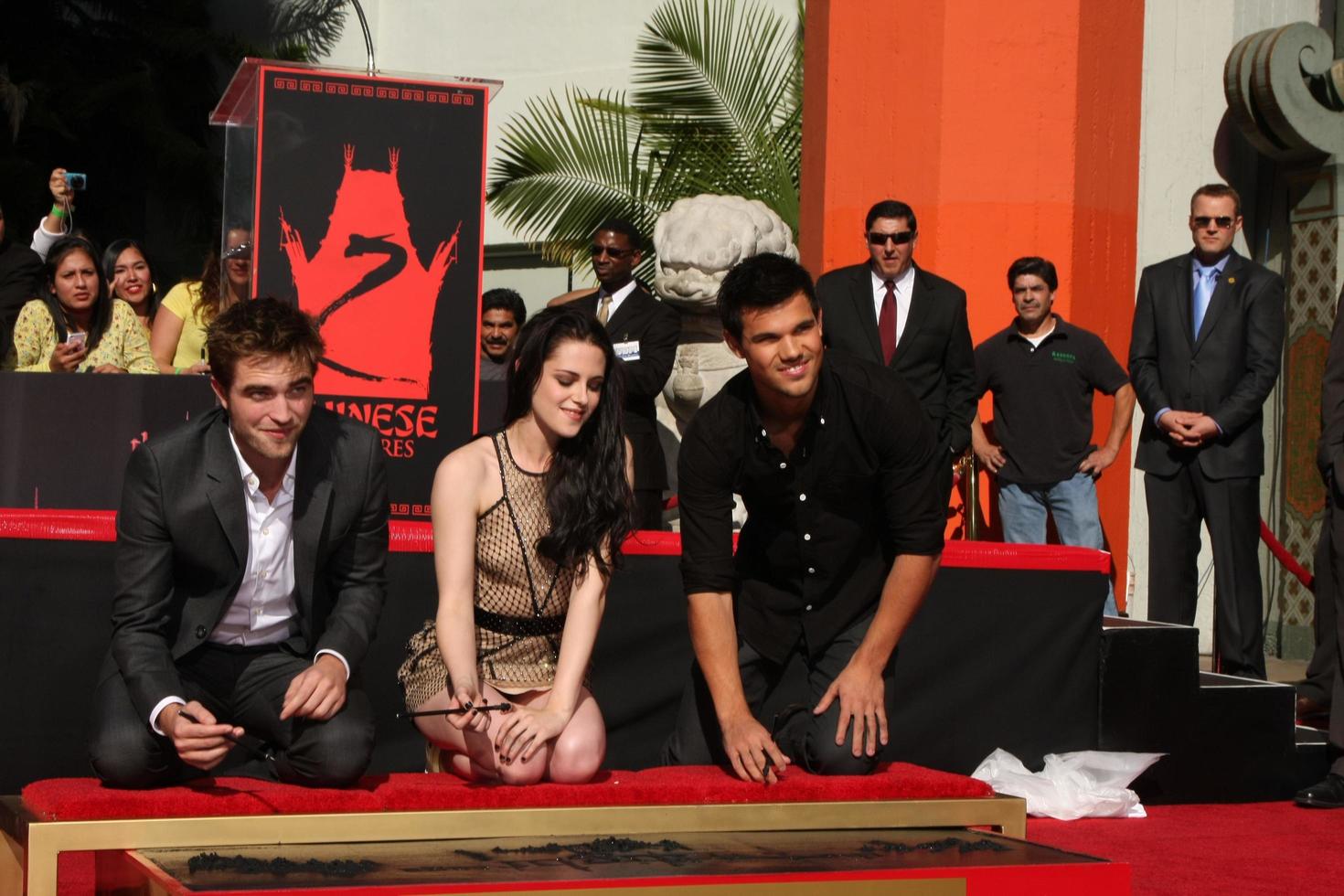 LOS ANGELES, NOV 3 - Robert Pattinson, Kristen Stewart, Taylor Lautner at the Handprint and Footprint Ceremony for the Twilight Saga Actors at Grauman s Chinese Theater on November 3, 2011 in Los Angeles, CA photo