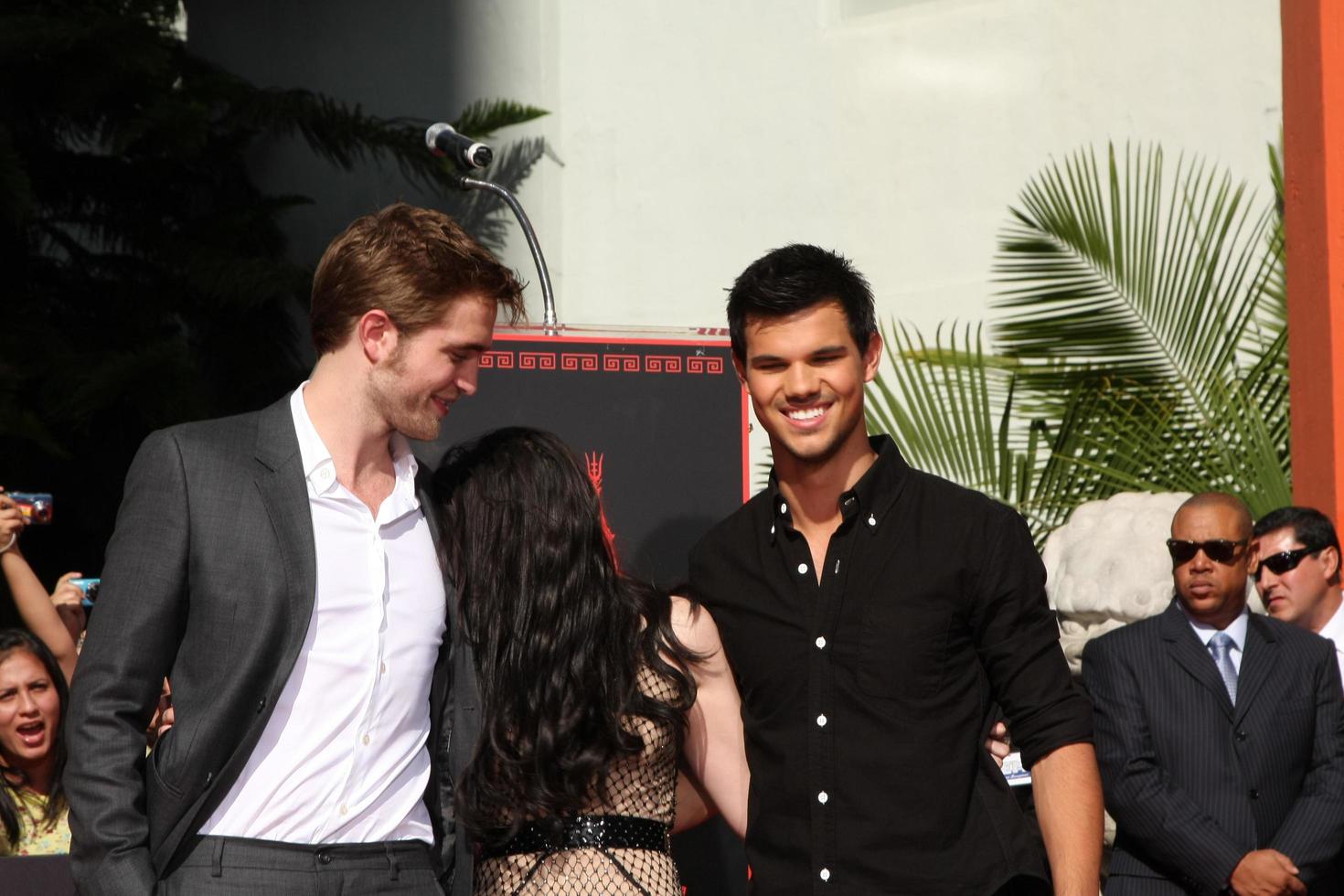 LOS ANGELES, NOV 3 - Robert Pattinson, Kristen Stewart, Taylor Lautner at the Handprint and Footprint Ceremony for the Twilight Saga Actors at Grauman s Chinese Theater on November 3, 2011 in Los Angeles, CA photo