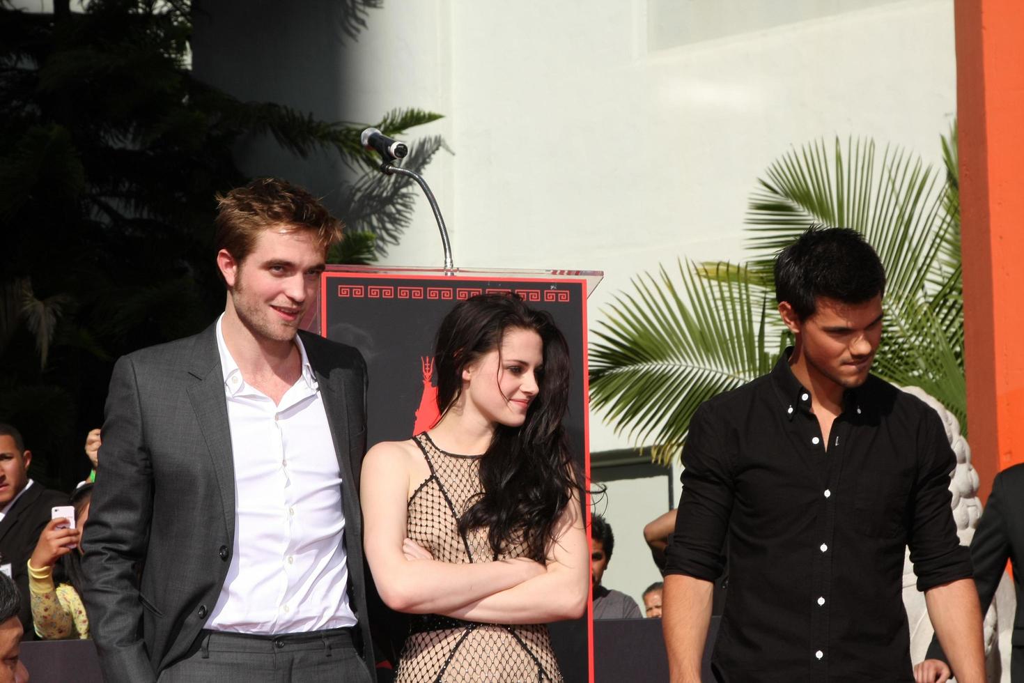 LOS ANGELES, NOV 3 - Robert Pattinson, Kristen Stewart, Taylor Lautner at the Handprint and Footprint Ceremony for the Twilight Saga Actors at Grauman s Chinese Theater on November 3, 2011 in Los Angeles, CA photo