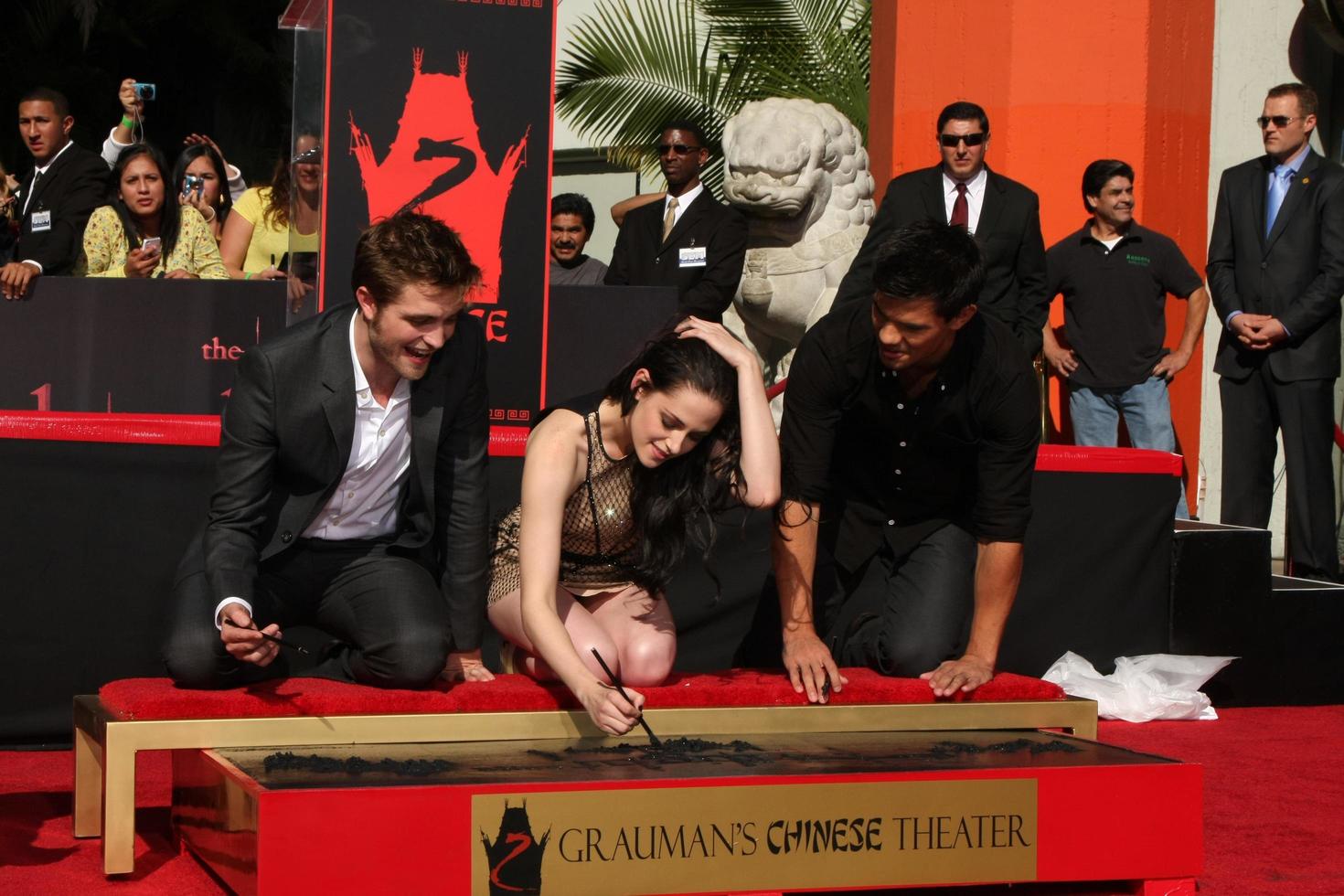 LOS ANGELES, NOV 3 - Robert Pattinson, Kristen Stewart, Taylor Lautner at the Handprint and Footprint Ceremony for the Twilight Saga Actors at Grauman s Chinese Theater on November 3, 2011 in Los Angeles, CA photo