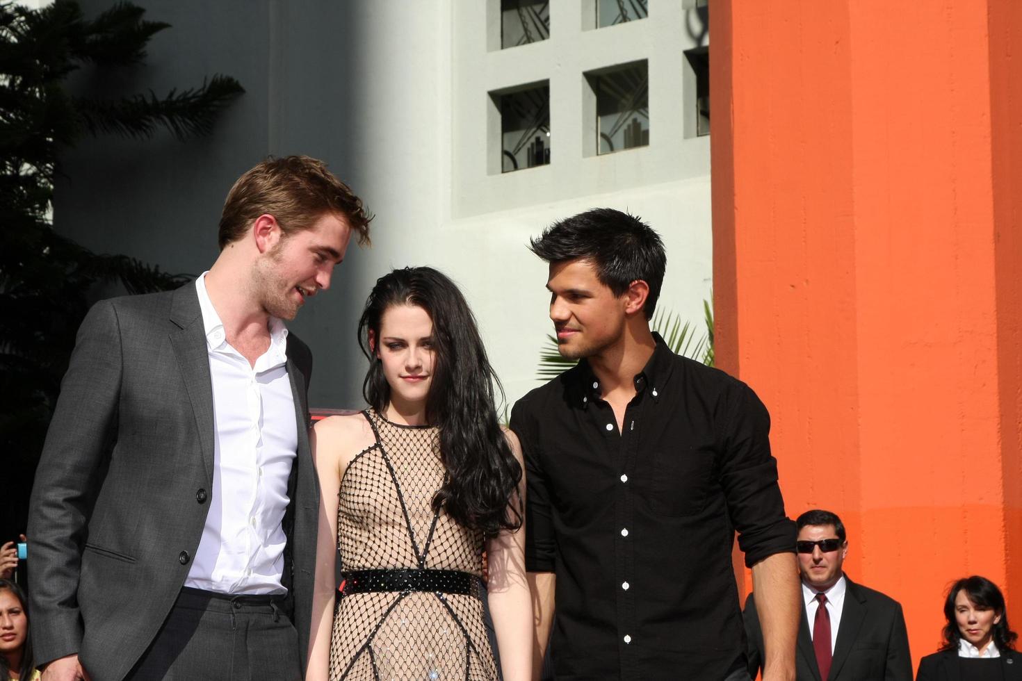 LOS ANGELES, NOV 3 - Robert Pattinson, Kristen Stewart, Taylor Lautner at the Handprint and Footprint Ceremony for the Twilight Saga Actors at Grauman s Chinese Theater on November 3, 2011 in Los Angeles, CA photo