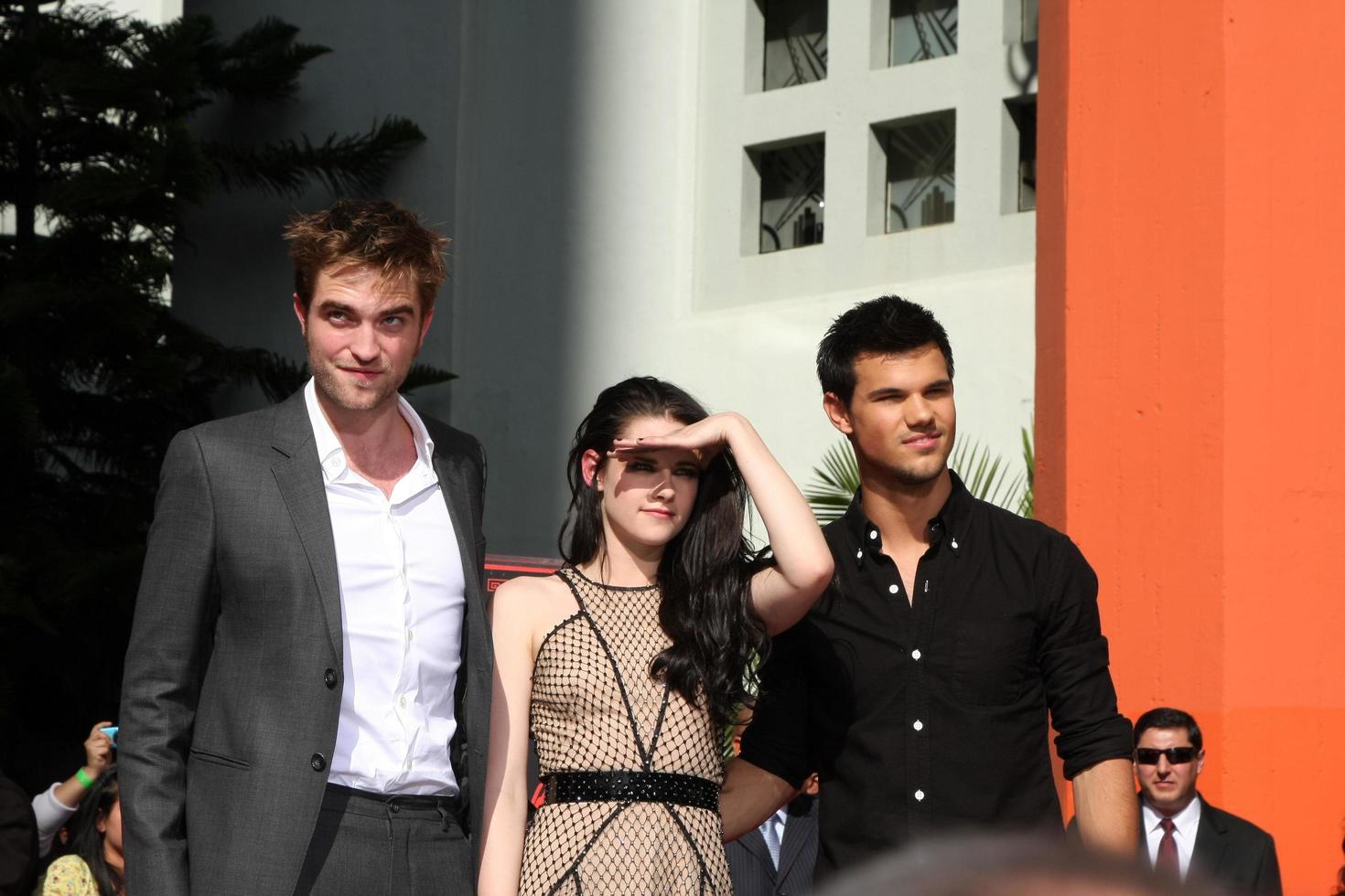 LOS ANGELES, NOV 3 - Robert Pattinson, Kristen Stewart, Taylor Lautner at the Handprint and Footprint Ceremony for the Twilight Saga Actors at Grauman s Chinese Theater on November 3, 2011 in Los Angeles, CA photo