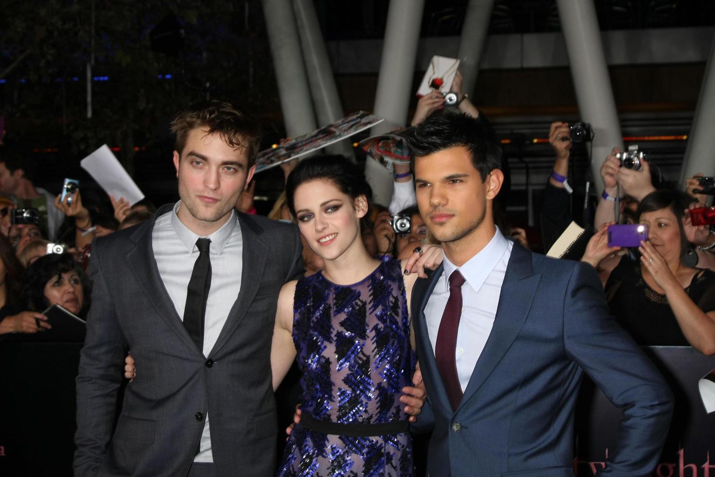 LOS ANGELES, NOV 14 - Robert Pattinson, Kristen Stewart, Taylor Lautner arrives at the Twilight - Breaking Dawn Part 1 World Premiere at Nokia Theater at LA LIve on November 14, 2011 in Los Angeles, CA photo