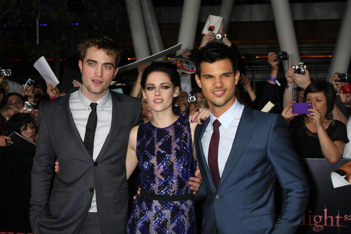 LOS ANGELES, NOV 14 - Robert Pattinson, Kristen Stewart, Taylor Lautner arrives at the Twilight - Breaking Dawn Part 1 World Premiere at Nokia Theater at LA LIve on November 14, 2011 in Los Angeles, CA photo