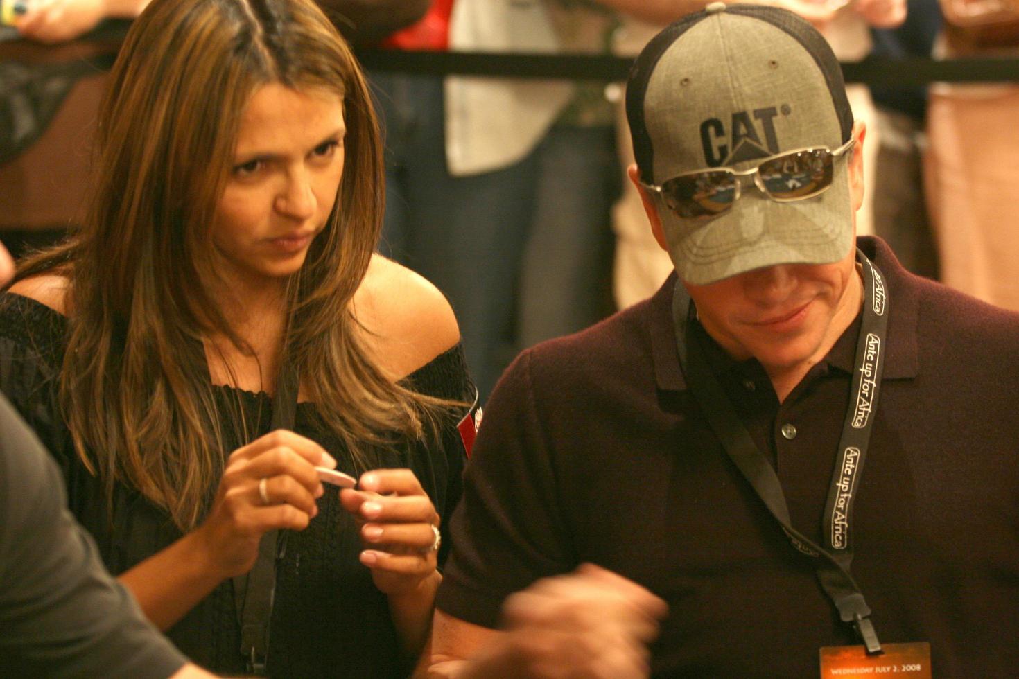 Matt Damon playing poker as his wife looks on at the Ante up for Africa Poker Tournament at the 2008 World Series of Poker, at the Rio All-Suite Hotel and Casino in
Las Vegas, NV
July 2, 2008
 2008 Kathy Hutchins Hutchins Photo