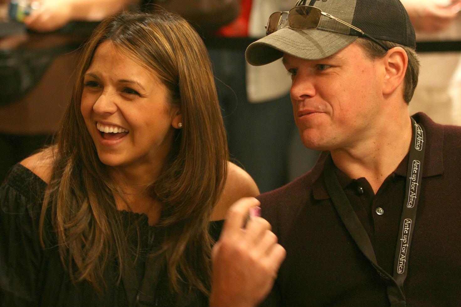 Matt Damon playing poker as his wife looks on at the Ante up for Africa Poker Tournament at the 2008 World Series of Poker, at the Rio All-Suite Hotel and Casino in
Las Vegas, NV
July 2, 2008
 2008 Kathy Hutchins Hutchins Photo