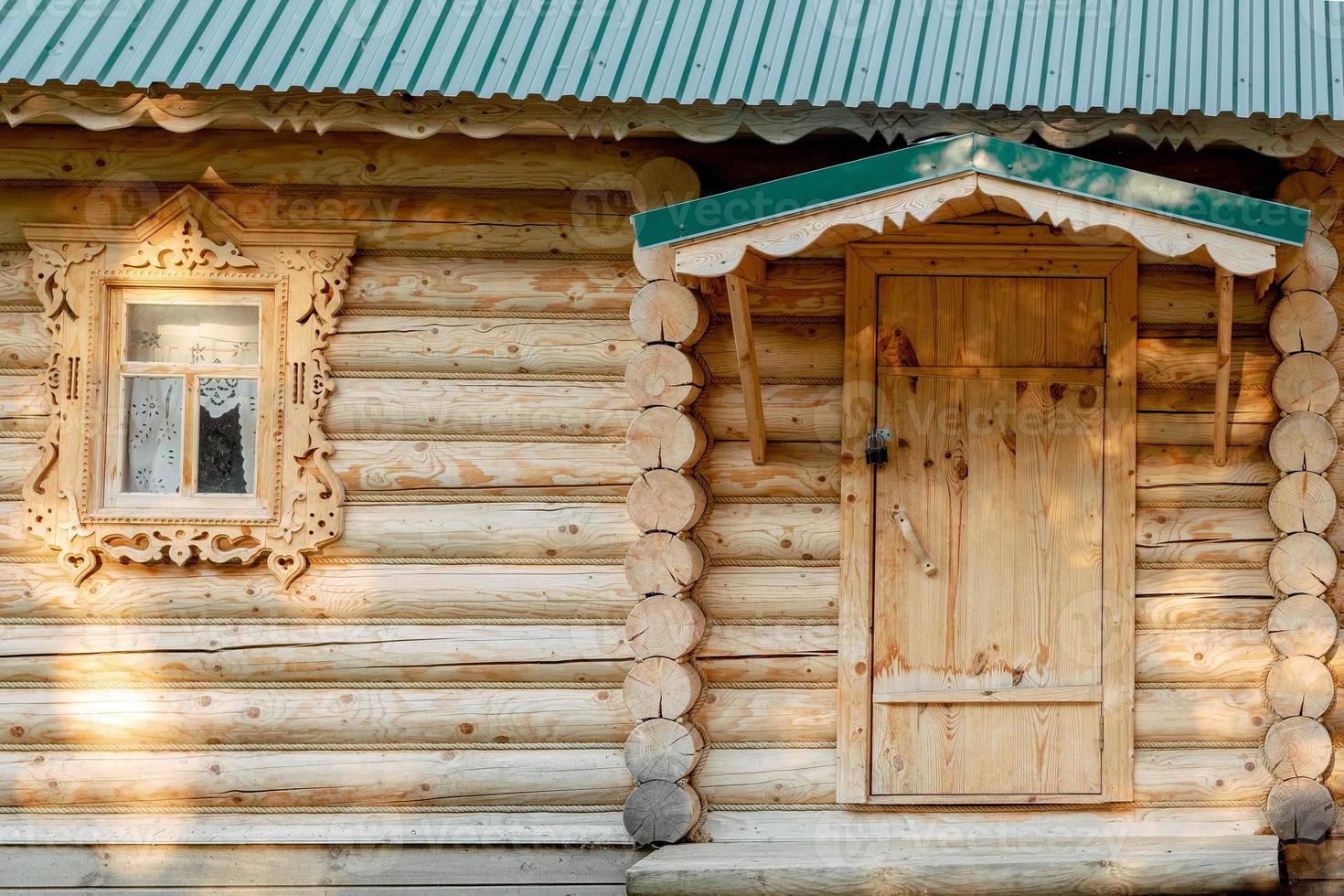 russian wooden house. traditions of Russia. Wooden windows. Log house. photo