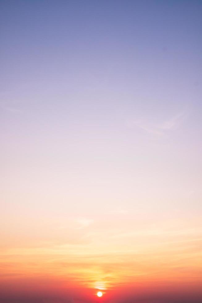 beautiful gradient orange clouds and sunlight on the blue sky perfect for the background, take in everning,Twilight photo