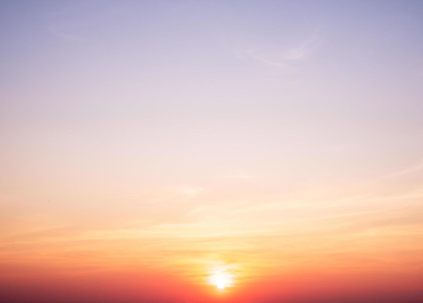 beautiful gradient orange clouds and sunlight on the blue sky perfect for the background, take in everning,Twilight photo