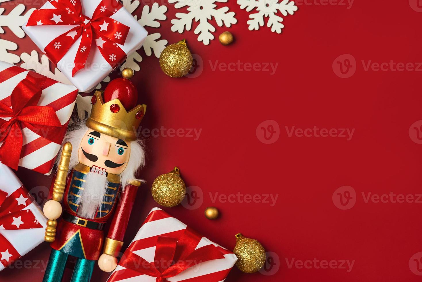 Christmas concept background. Top view of Christmas ornament and christmas wooden nutcracker toy solider with space for text photo