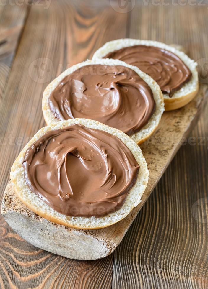 Slices of bread with chocolate paste photo