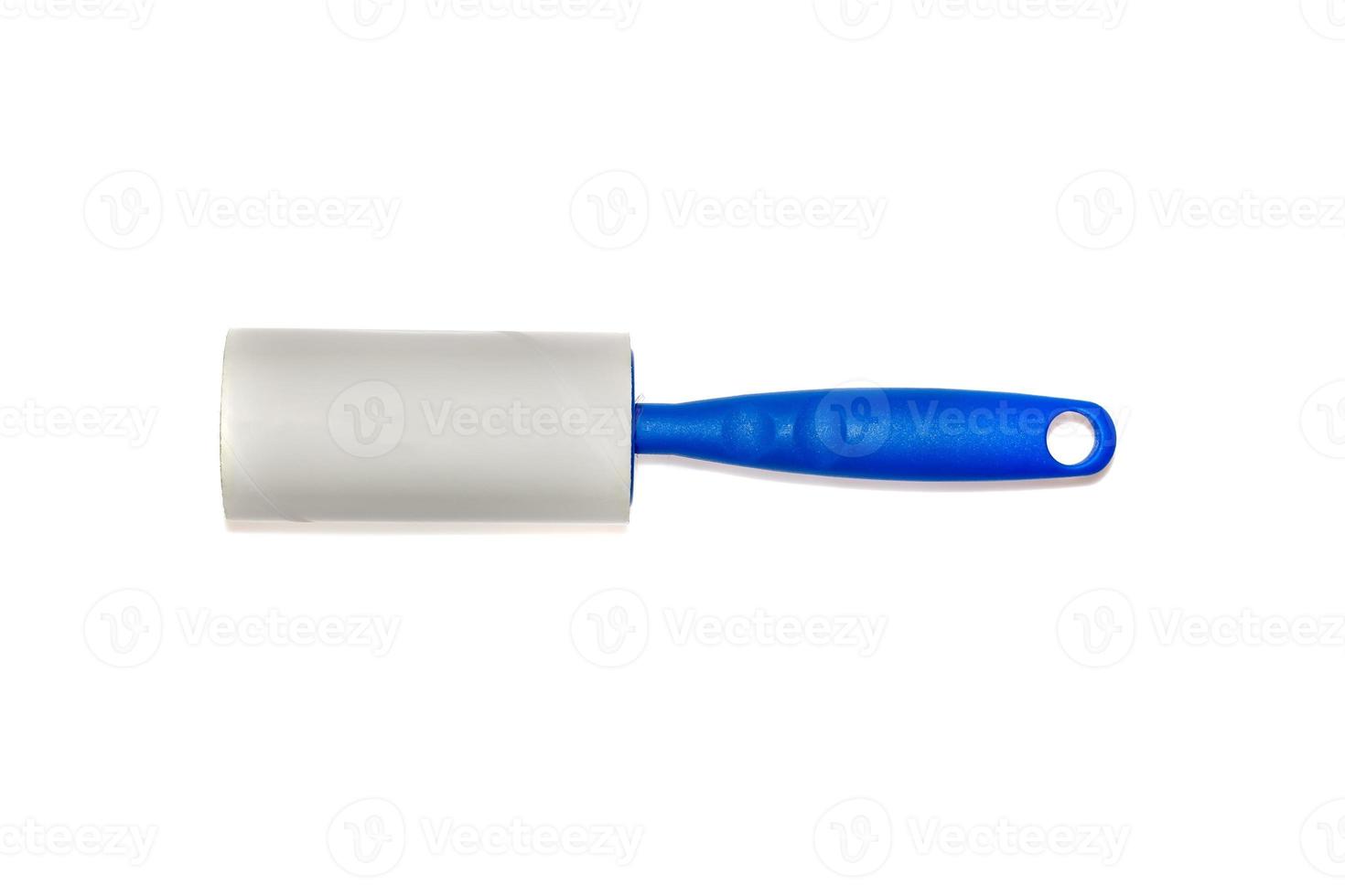 Adhesive roller for cleaning clothes from animal fur and hair isolated on white background with shadows photo