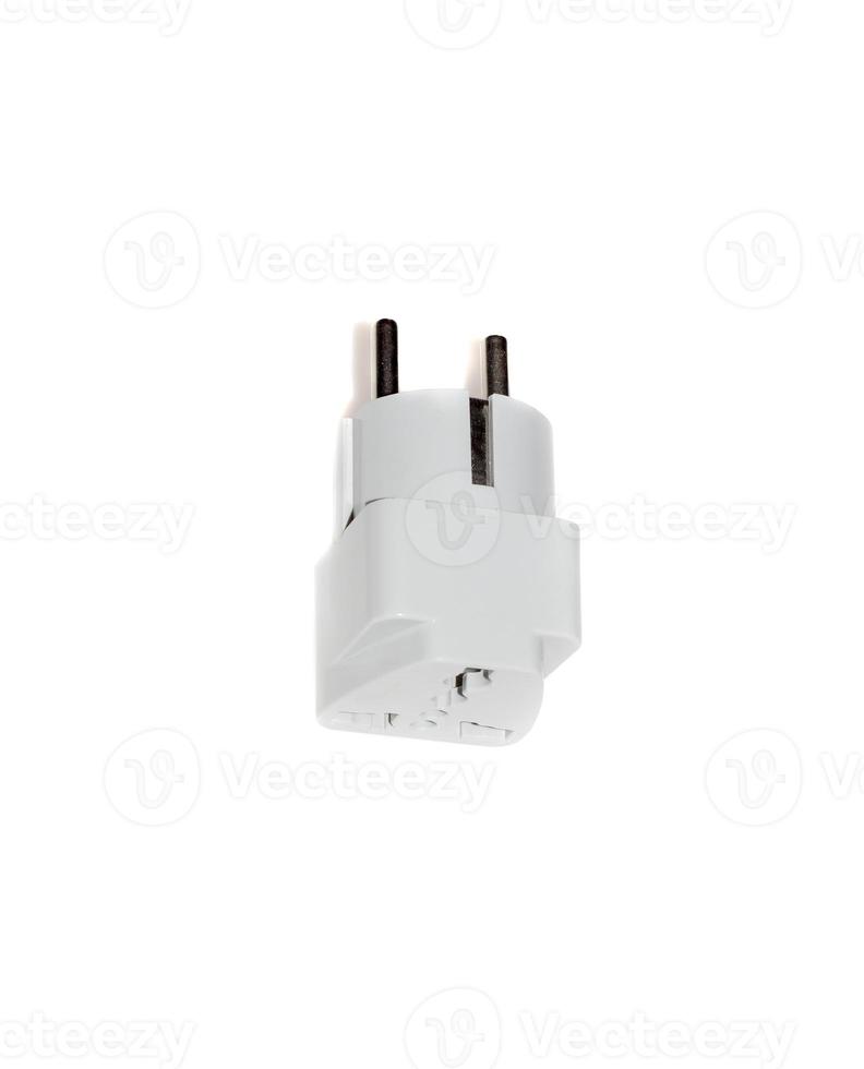 Close up universal American to European travel adapter converter plug. UK and USA to EU converter plug adapter outlet. Object isolated on white background photo