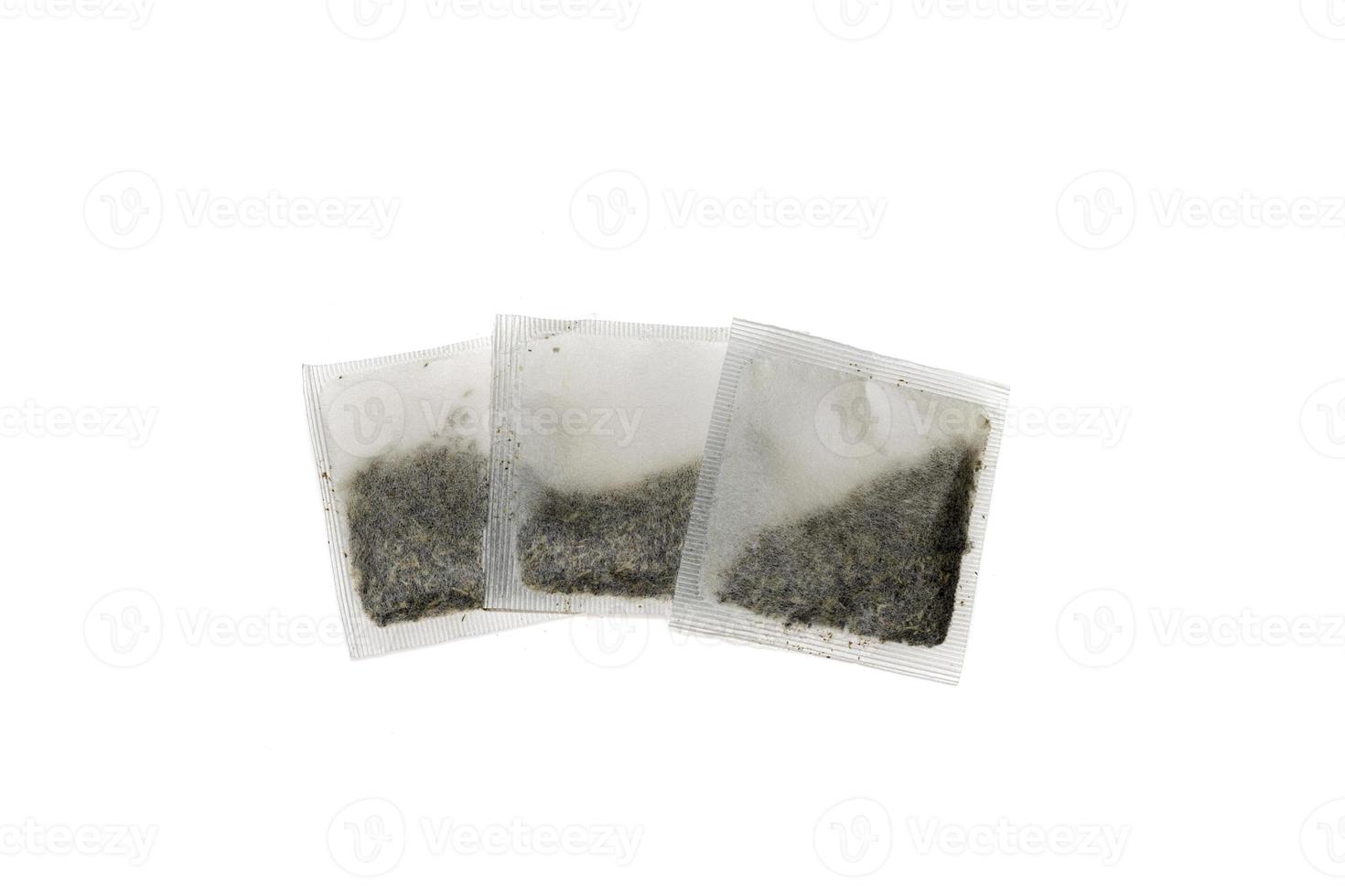 Several tea bags , isolated on white background photo