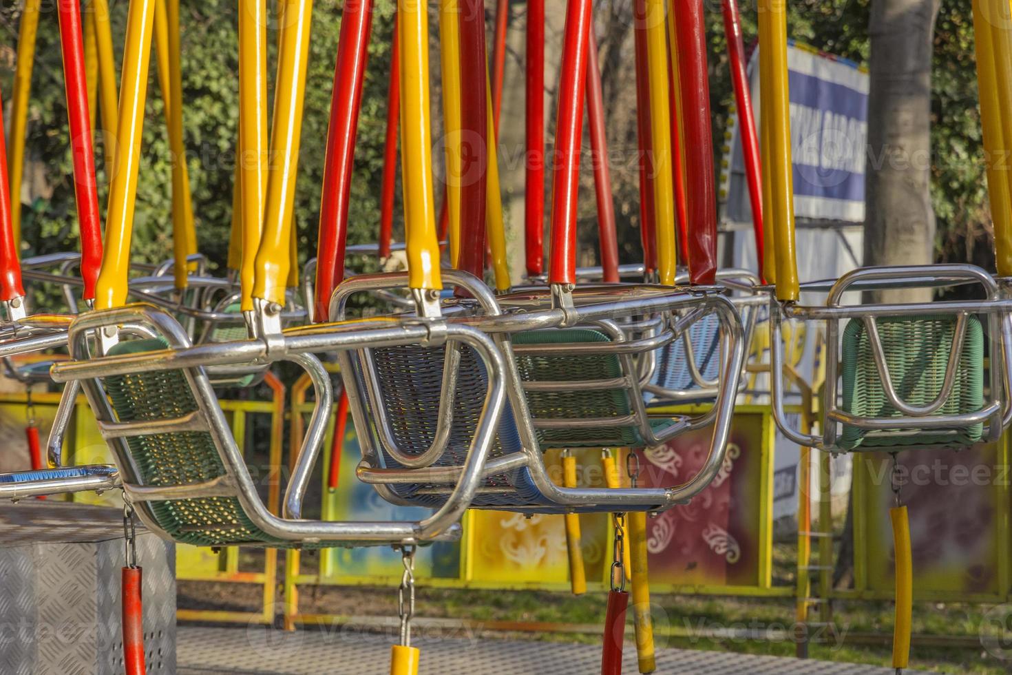 Empty swings on children playground. Close photo