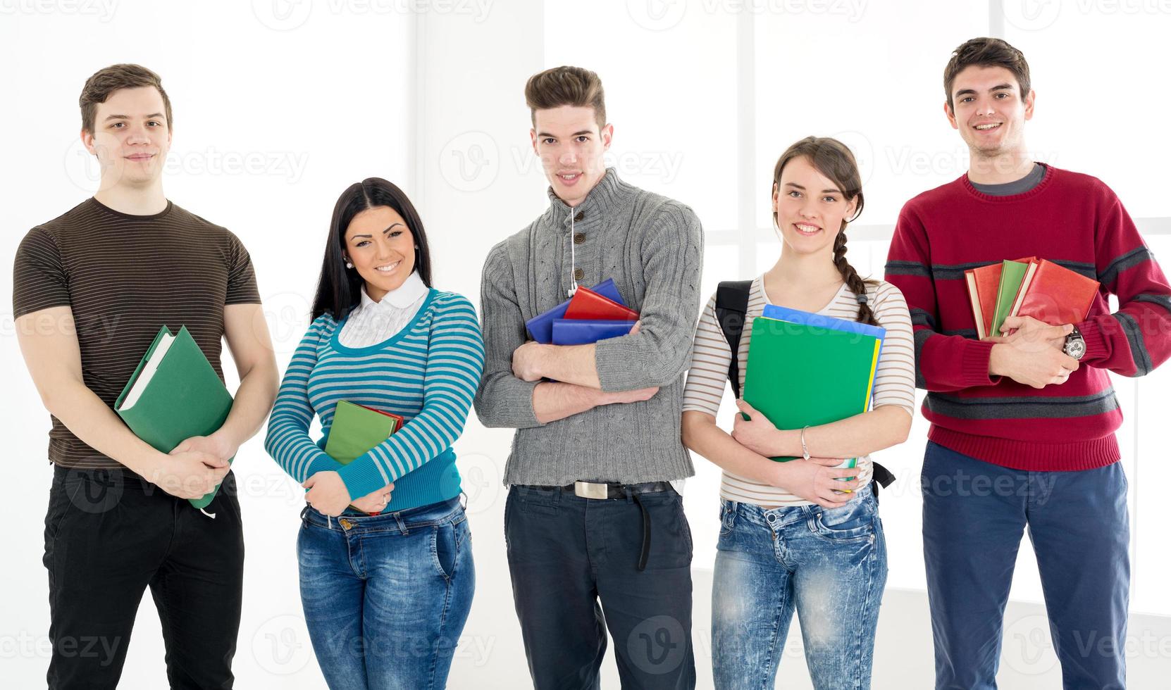 Group Of Smiling Students With Books photo