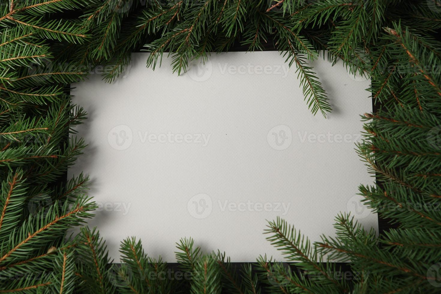 Holidays greeting card or banner composition with pine tree branches. Merry Christmas background and Happy New Year 2023. photo