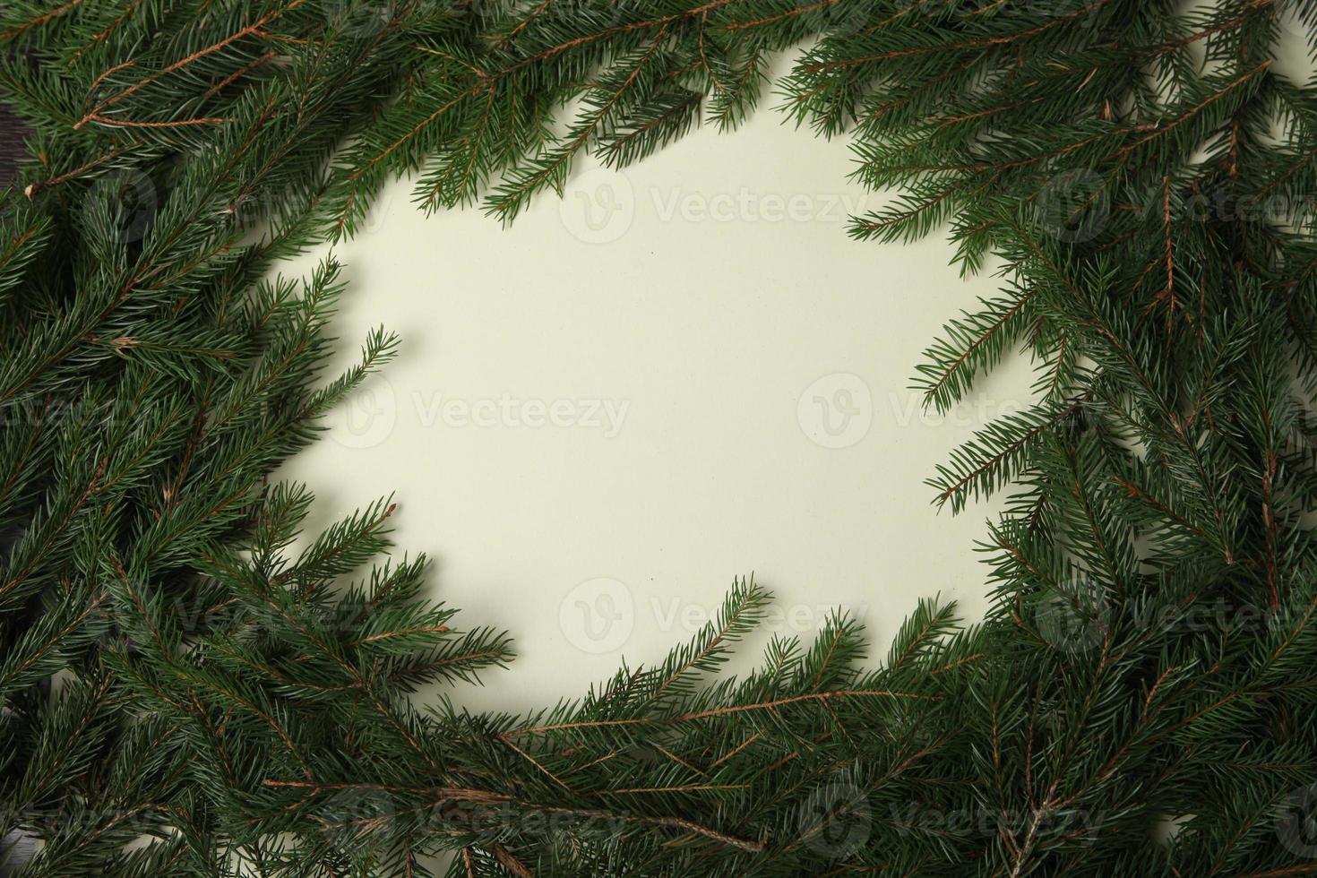 Holidays greeting card or banner composition with pine tree branches. Merry Christmas background and Happy New Year 2023. photo