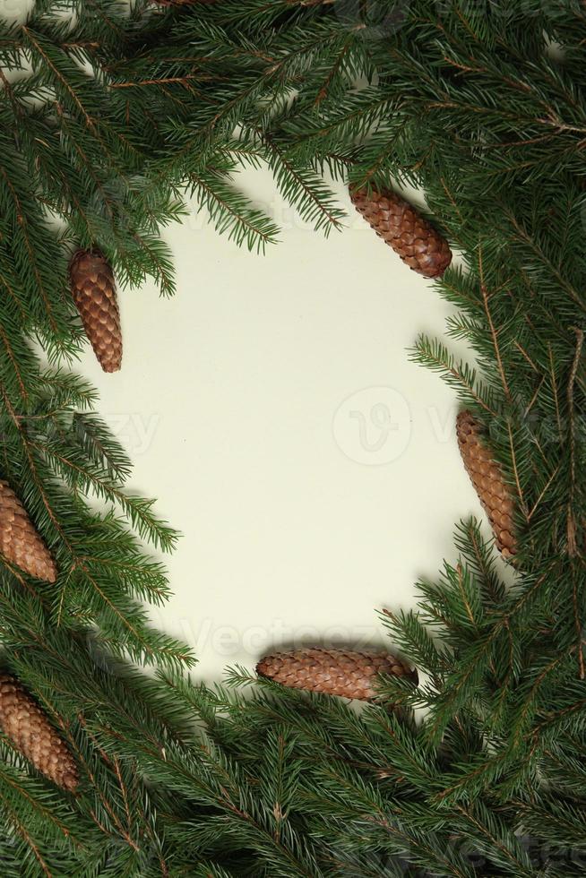 Holidays greeting card or banner composition with pine tree branches. Merry Christmas background and Happy New Year 2023. photo