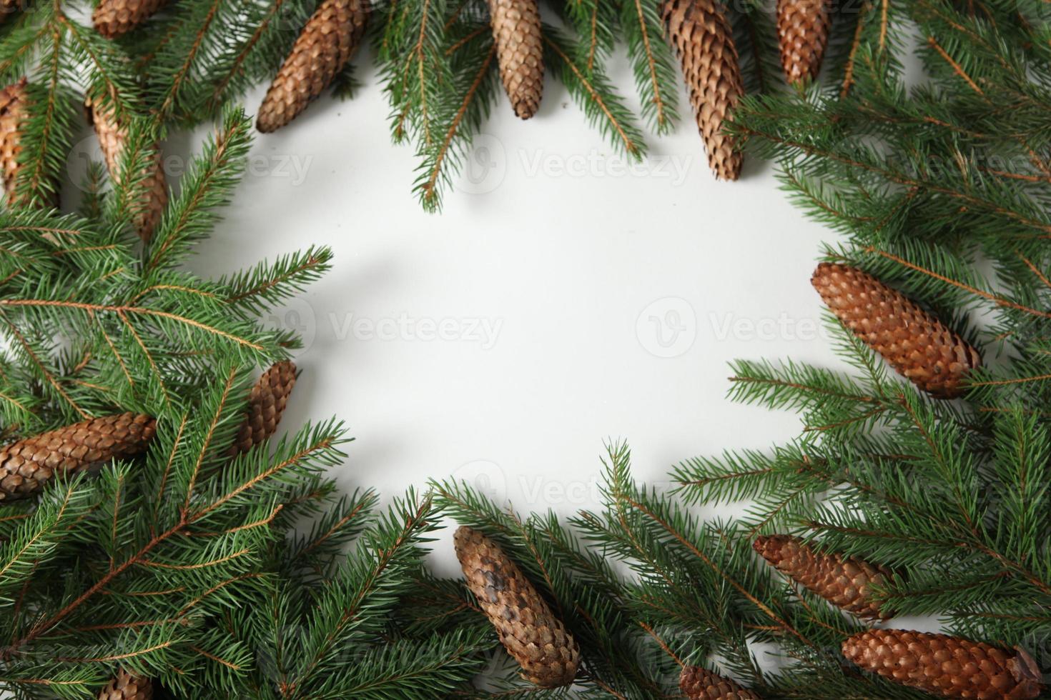 Holidays greeting card or banner composition with pine tree branches. Merry Christmas background and Happy New Year 2023. photo